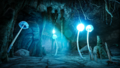 A group of glowing Round Blue Cap Mushrooms in the darkness of a cave.